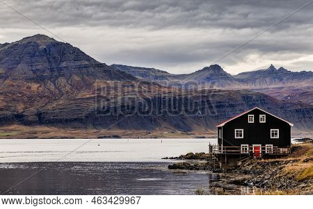 Boathouse, Fjords And Mountains In Djupivogur, Eastfjords, Iceland. Picturesque View Of Calm Waters 