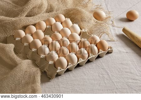 Fresh Organic Chicken Eggs In Carton Pack Or Egg Paper Container On A Sacking. Zero Waste Packaging 