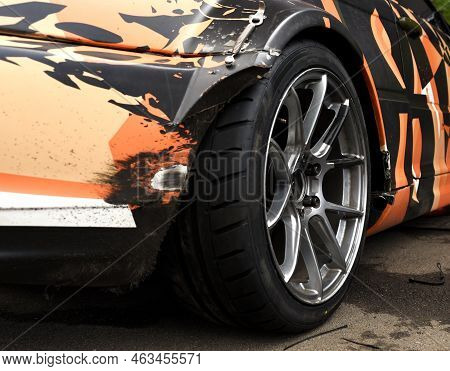 Alloy Wheel With Calipers And Racing Brakes Of The Sport Car. Racing Brake Disc And Low Profile Tyre