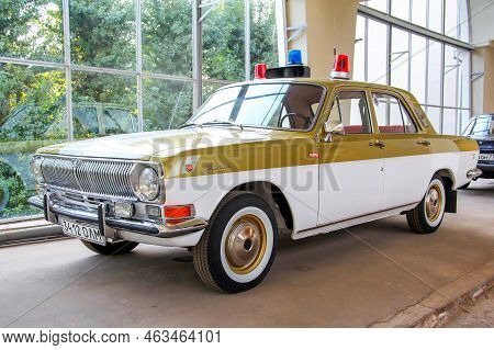 Moscow, Russia - August 19, 2014: Olympic Flame Escort Vehicle Gaz 24 Volga At The Automotive Indust