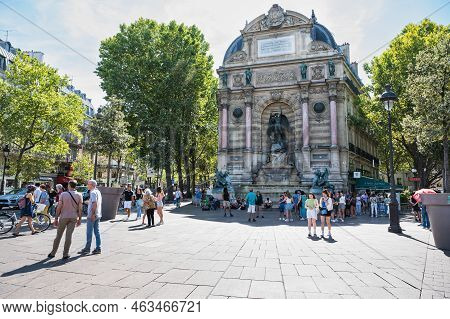 Paris, France - August 27 2022: People By The Fontaine Saint-michel Located In Place Saint-michel In