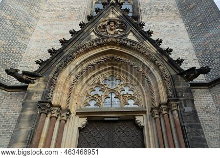 Bottom View Of Gothic Vaults In Front Of The Entrance To Church Of St. Prokop With Gargoyles And App