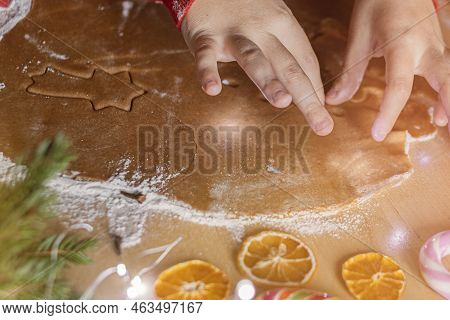 Closeup Childrens Hands Make Christmas Ginger Cookies.