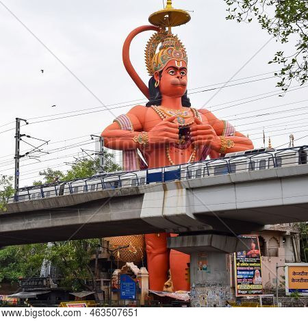 New Delhi, India - June 21, 2022 - Big Statue Of Lord Hanuman Near The Delhi Metro Bridge Situated N