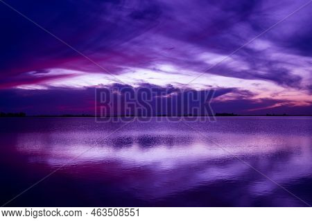 Blue Hour In A Lagoon. Clouds Cover The Sky.
