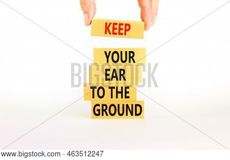 Keep Your Ear To The Ground Symbol. Concept Words Keep Your Ear On The Ground On Wooden Blocks. Busi