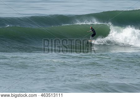 Local Surfer Riding Waves
