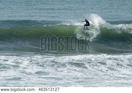 Local Surfer Riding Waves