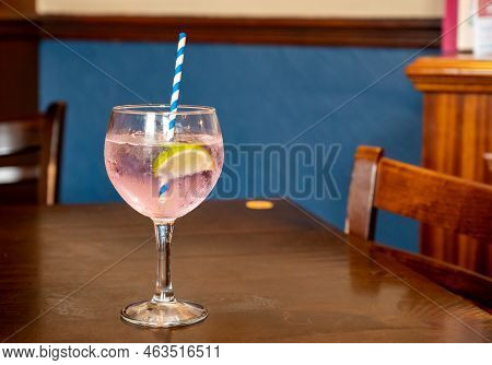 Glass Of Gin And Tonic Cocktail Served In Old Vintage Scottisch Pub, Drinking Gin In Edinburgh, Uk