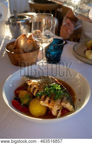 Provence Cuisine, Filet Of Seabass White Fish Served With Potatoes, Tomatoes And .bouillabaisse Jus