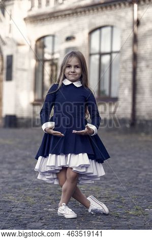 Plie Style Stance. Little Ballerina Wear School Uniform. Small Ballet Dancer Outdoors. Ballet School