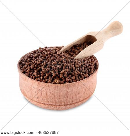 Wooden Bowl With Scoop And Buckwheat Tea Granules On White Background