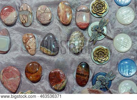 Semi-precious Stones - Agate, Jasper And Mother-of-pearl On A Gray Background.