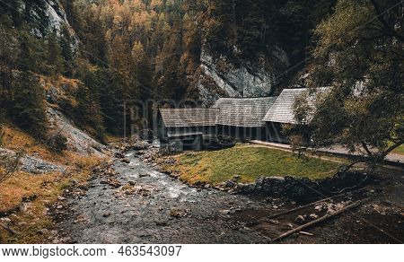 Photo Of A Beautiful Wooden Cabin With River In The Forest From Above - Mlyny Oblazy (slovakia) - Ta