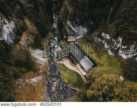 Photo Of A Beautiful Wooden Cabin With River In The Forest From Above - Mlyny Oblazy (slovakia) - Ta
