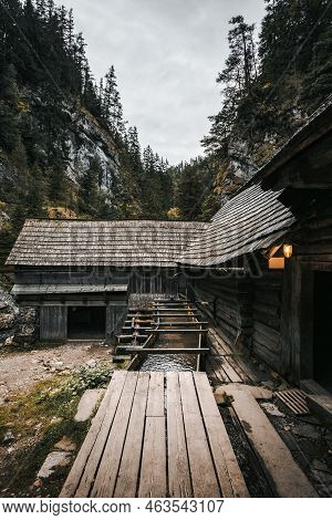 Vertical Photo Of A Beautiful Wooden Cabin Deep In The Forest - Mlyny Oblazy (slovakia). Old Wooden 
