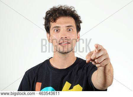 Young Boy Pointing Finger At Camera And Looking In Amazement