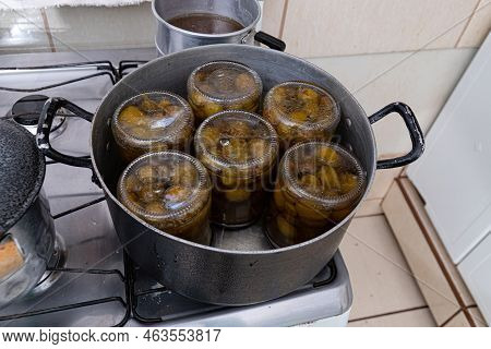 Glass Jars With Mangaba Jam Inside In A Pan