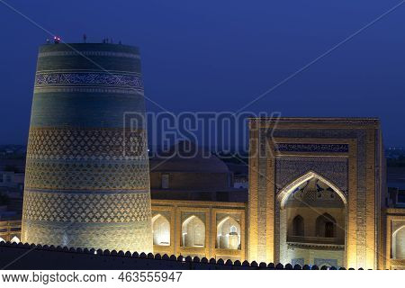 Khiva, Uzbekistan - September 06, 2022: Kalta-minor Minaret And Portal Of The Ancient Madrasah Of Mu