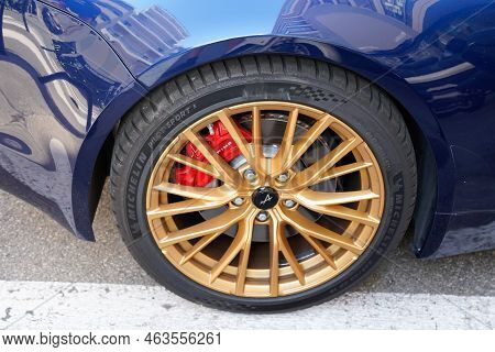 Bordeaux , Aquitaine  France - 10 10 2022 : Alpine A110 Sports Car Golden Front Wheel Modern Renault