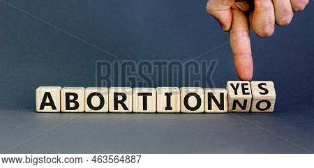 Abortion Yes Or No Symbol. Concept Words Abortion Yes Or Abortion No On Wooden Cubes. Doctor Hand. B