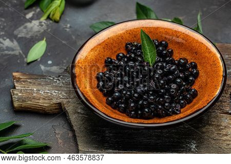 Wild Berries, Northern Berry: Lingonberry, Blueberry, Bowl Of Fresh Maqui Berry On Dark Background, 