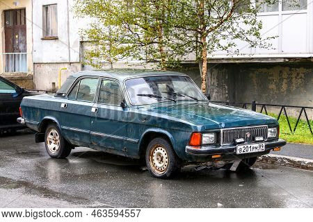 Nadym, Russia - September 4, 2022: Green Saloon Car Gaz-3102 Volga In The City Street.