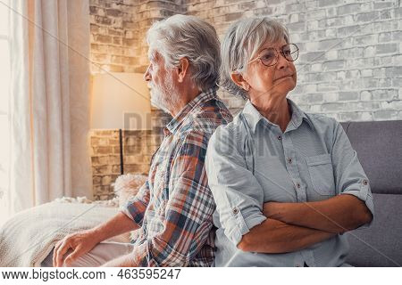 Portrait Of Couple Of Two Old Seniors Arguing And Looking Other Sides After Fighting. Woman And Man 