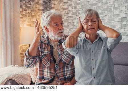 Man Shouting And Talking To Woman Tired Thinking On Separation Covering Her Ears.