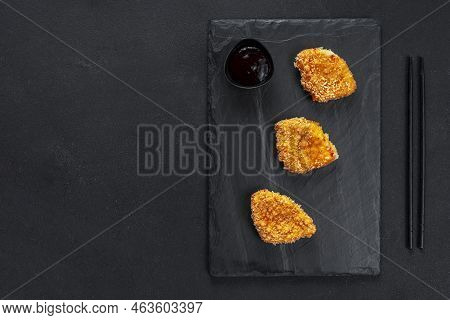 Chinese Fried Chicken Nuggets In Batter On A Black Background. Asian Cuisine. Tahu Nuggets Or Tofu, 