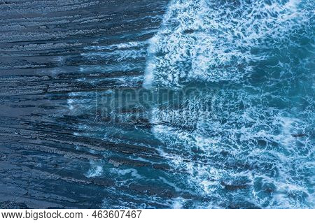 Aerial Drone Landscape Bird's Eye View Of Sunset Over Welcombe Mouth Beach In Devon England