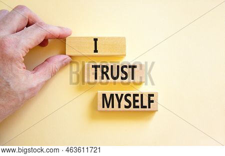 I Trust Myself Symbol. Concept Words I Trust Myself On Wooden Blocks. Businessman Hand. Beautiful Wh