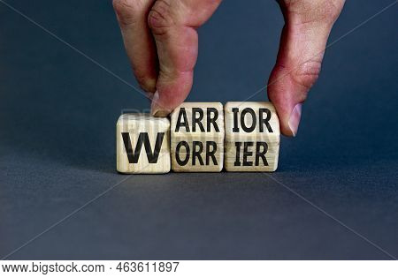 Be Warrior Not Worrier Symbol. Concept Words Warrior And Worrier On Wooden Cubes. Businessman Hand. 