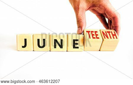 Juneteenth In June Symbol. Concept Words Juneteenth And June On Wooden Cubes. Beautiful White Table 