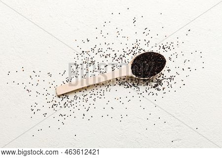 Quinoa Seeds In Spoon On Colored Background. Healthy Kinwa In Small Spoon. Healthy Superfood.