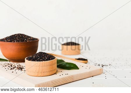 Quinoa Seeds In Bowl On Colored Background. Healthy Kinwa In Small Bowl. Healthy Superfood.