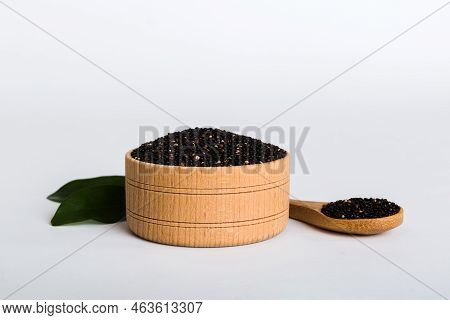 Quinoa Seeds In Bowl And Spoon On Colored Background. Healthy Kinwa In Small Bowl. Healthy Superfood