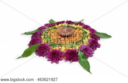 Flower Rangoli For Diwali Festival Made Using Marigold Or Zendu Flowers And Clay Oil Lamp