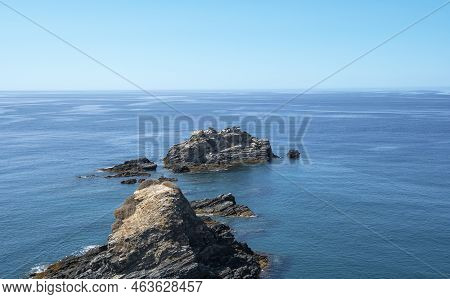 Rock Formation Entering The Waters Of The Mediterranean Sea In The Coastal Village Of Almunecar, Spa