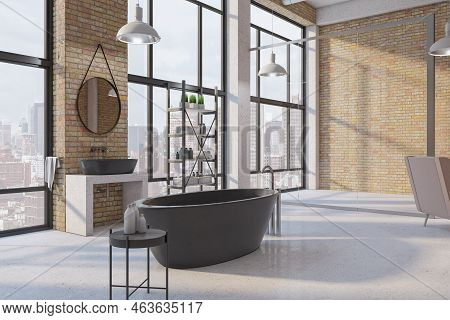 Perspective View On Modern Black Bath In Huge Sunlit Loft Style Bathroom With Dark Metallic Furnitur