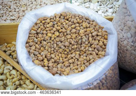 Rolled Up Sack Full Of Tiger Nuts Or Chufas. Displayed At Street Market Stall