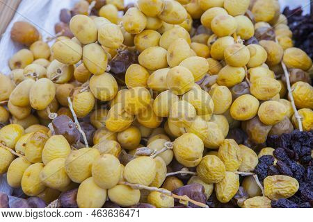 Bunches Of Round Yellow Dates, Barhi Variety. Displayed At Street Market Stall