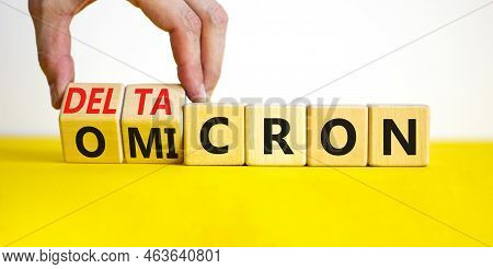 Covid-19 Omicron Or Deltacron Symbol. Doctor Turns Cubes And Changes The Word Omicron To Deltacron. 