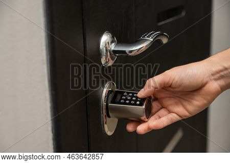 Woman Opens The Combination Lock On The Door To The Apartment. Keyless Entry.