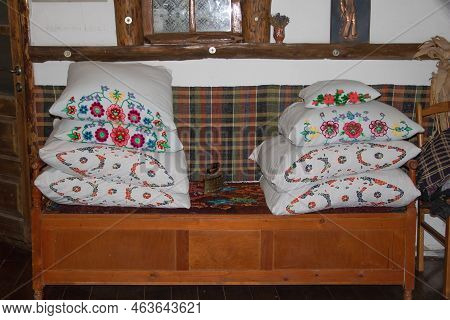 Orheiul Vechi, Moldova - June 14, 2021 Some Pillows And A Very Old Iron Placed In A Traditional Rest