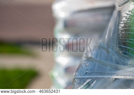 Selective Focus On Cellophane Shrink Wrap On Pallets Of Goods For Transport.