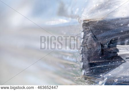 Selective Focus On Cellophane Shrink Wrap On Pallets Of Goods For Transport.