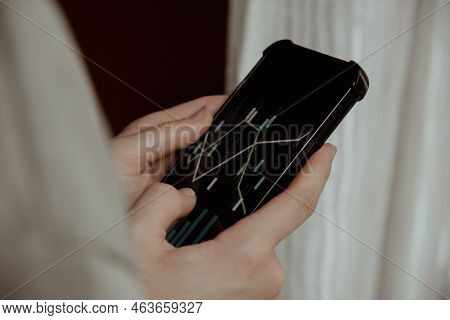 Female Hands Holding Phone, Checking Stock Market Graph For Tranding And Investment In Security Exch