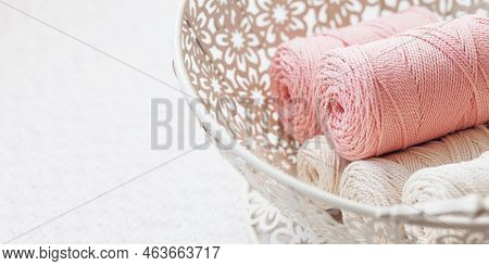 Handmade Macrame Braiding And Cotton Threads In White Basket. Cotton Macrame Cords And Ropes Against