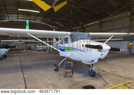 Photo Of Old Angar With Several Airplanes Ready For Flight.